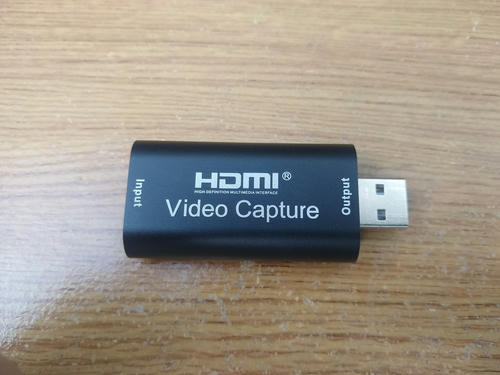Picture of HDMI capture dongle on desk