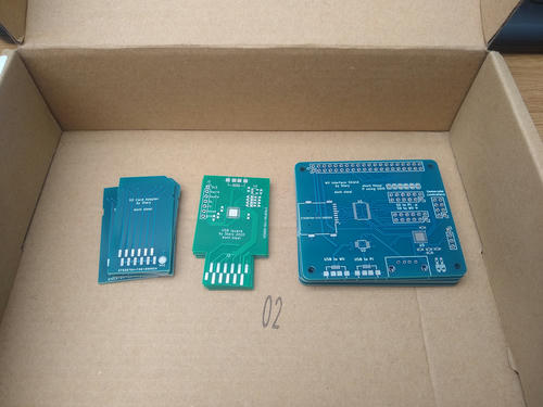 Picture of 3 PCBs above, in a box