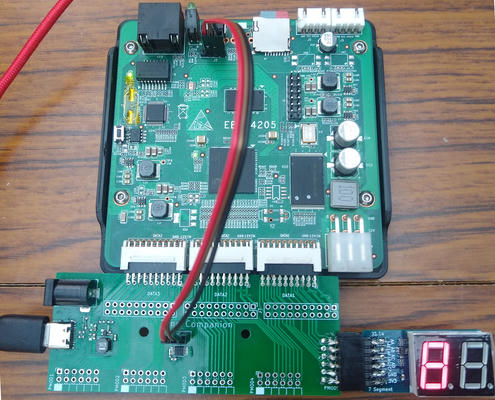 The Zynq processor board (top), connected to my board (bottom), which is connected to USB and a 7 segment PMOD